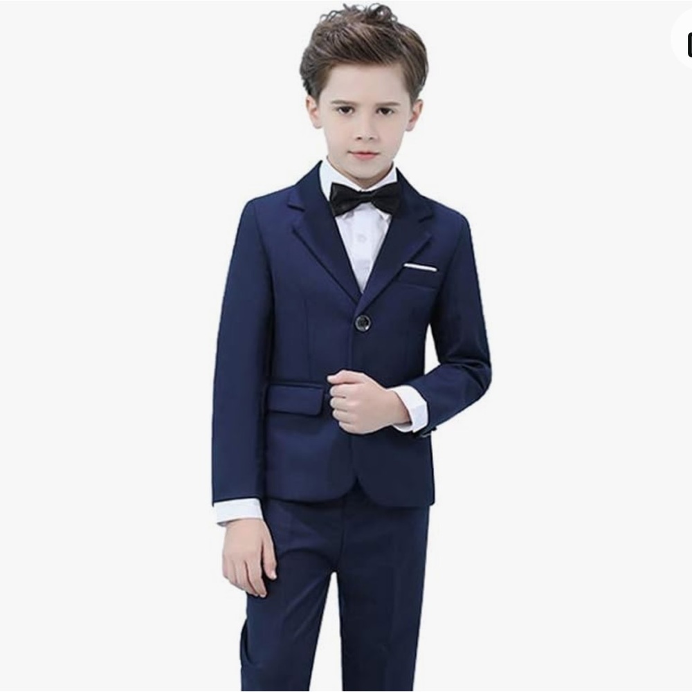 Boys suit, size 8. Tags still on! Includes jacket, pants, bow tie and shirt.
